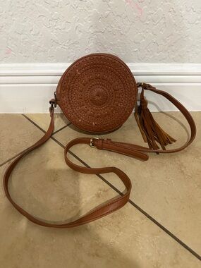 Round Brown Crossbody Bag with Tassel Accent